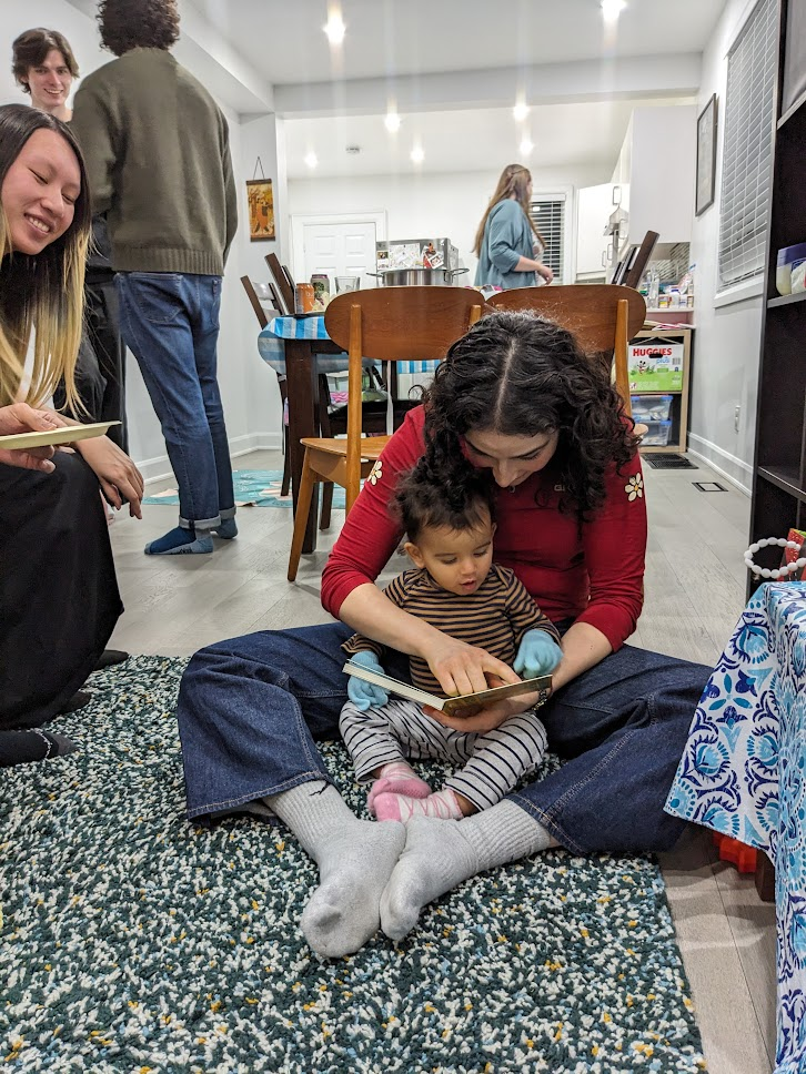 Ophira reading with lab members